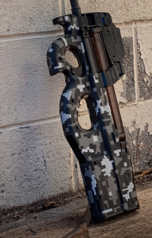 victran:  FN P90 in digital urban camo 50 rounds that you probably wont even feel