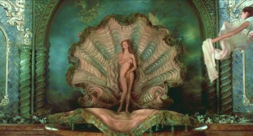   movie still from Terry Gilliam’s “The Adventures of Baron Munchausen” (1988) with Uma Thurman as Venus  