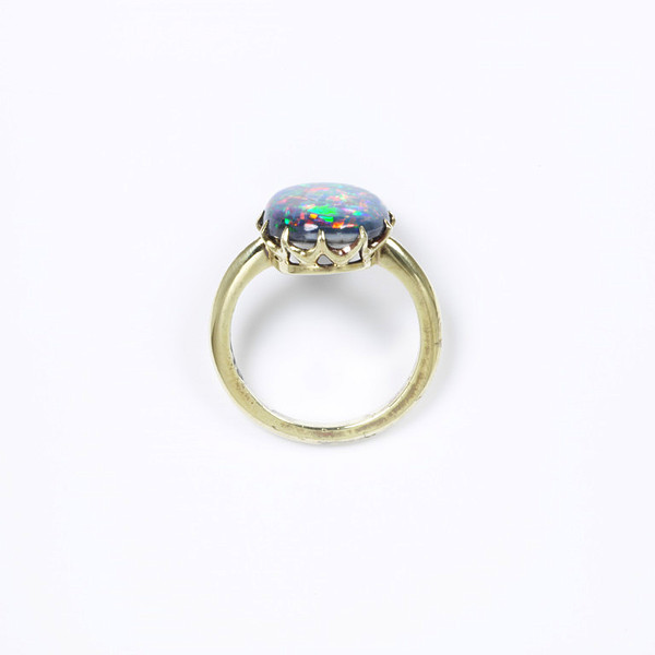  Ring. 1850-1913. Radiant and rare Black Opal embedded and mounted on gold.  