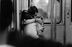  “In transit. I saw them. Just two kids in love. I got my 135 mm and made one shot.” (by Daniel Merle) 