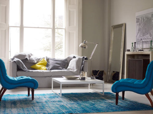 Bright Rooms: Aquatic Influence
Aquamarine tufted chairs and a coordinating rug give a luxurious pop of color to a room decorated in soft grays, silvers and whites. Get more home inspiration ideas here.