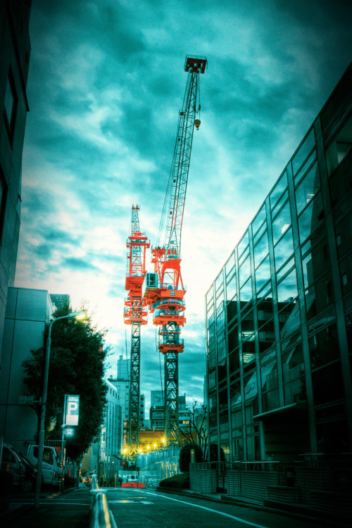 Construction cranes in the Shibuya area of Tokyo.