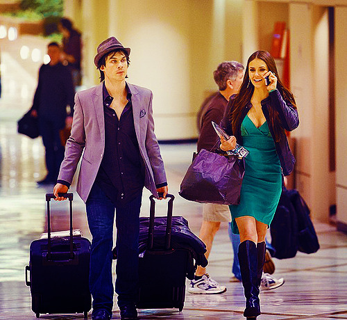 Ian is such a SWEETBoyFriend rolling Nina’s bag through the airport !