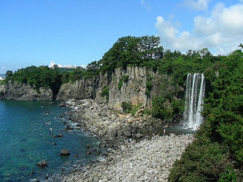 by Massart on Flickr.Jeongbang Waterfall in Jeju Island, South Korea.