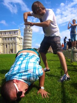 erebreakofday:  This is how you do travel photography. Roughly ten million times better than the typical holding up the building pose. the girl in the background is rethinking her choice of cliche photo pose 