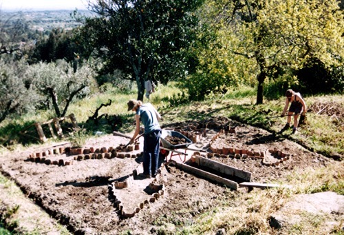 permascot:
“ A veg garden we were building in Portugal, 2004. We used old roof tiles to edge the beds. Water channels surround the bed for irrigation from a water tank.
©JReid
”