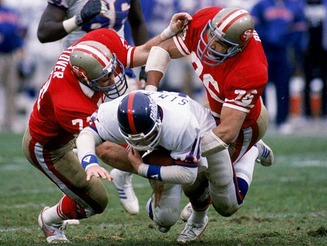 SI Photo Blog — Giants quarterback Phil Simms gets tackled by