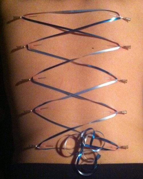 ginandjews:  Since I’ve now crossed the line of posting my own kink photos: this was my first corset piercing. 