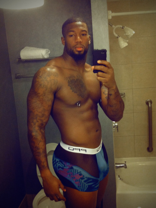 mistahsonasty:  Ray Edwards Nfl player is so mf sexy! Check the nipple piercing, tight ass underwear. U know he getting down on the low.   Black man soooo sexy! :-)