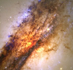 :  The center of Centaurus A, the result of a collision between two galaxies. 