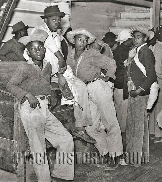 Teens waiting to get paid for cotton picking inside Marcella Plantation’s store