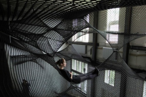 twinfawns:  Net by design collective Numen consists of multiple layers of flexible nets suspended in the air. The flat layers of the net are subsequently connected to one another on counterpoints thus forming a “floating landscape” open for visitors