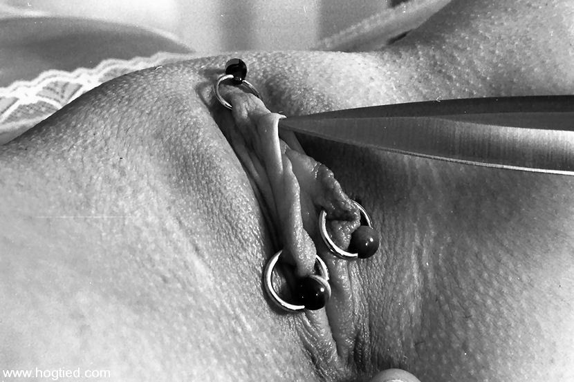 Pierced pussy. Point of a sharp knife under her clithood, this is where the Sub needs