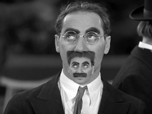 Groucho Marx as Christopher &ldquo;Kid&rdquo; Reid Moustair