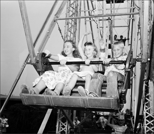 Pomona Fair, 1951Kids and adults alike enjoy the fun entertainment at the county fair. Some of the f