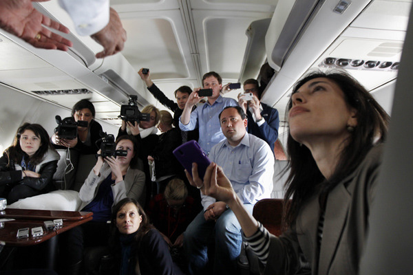 Mitt Romney’s very tired press corps–and my iPhone (because I am always taking pictures!) Photo by Gerald Herbert/AP.