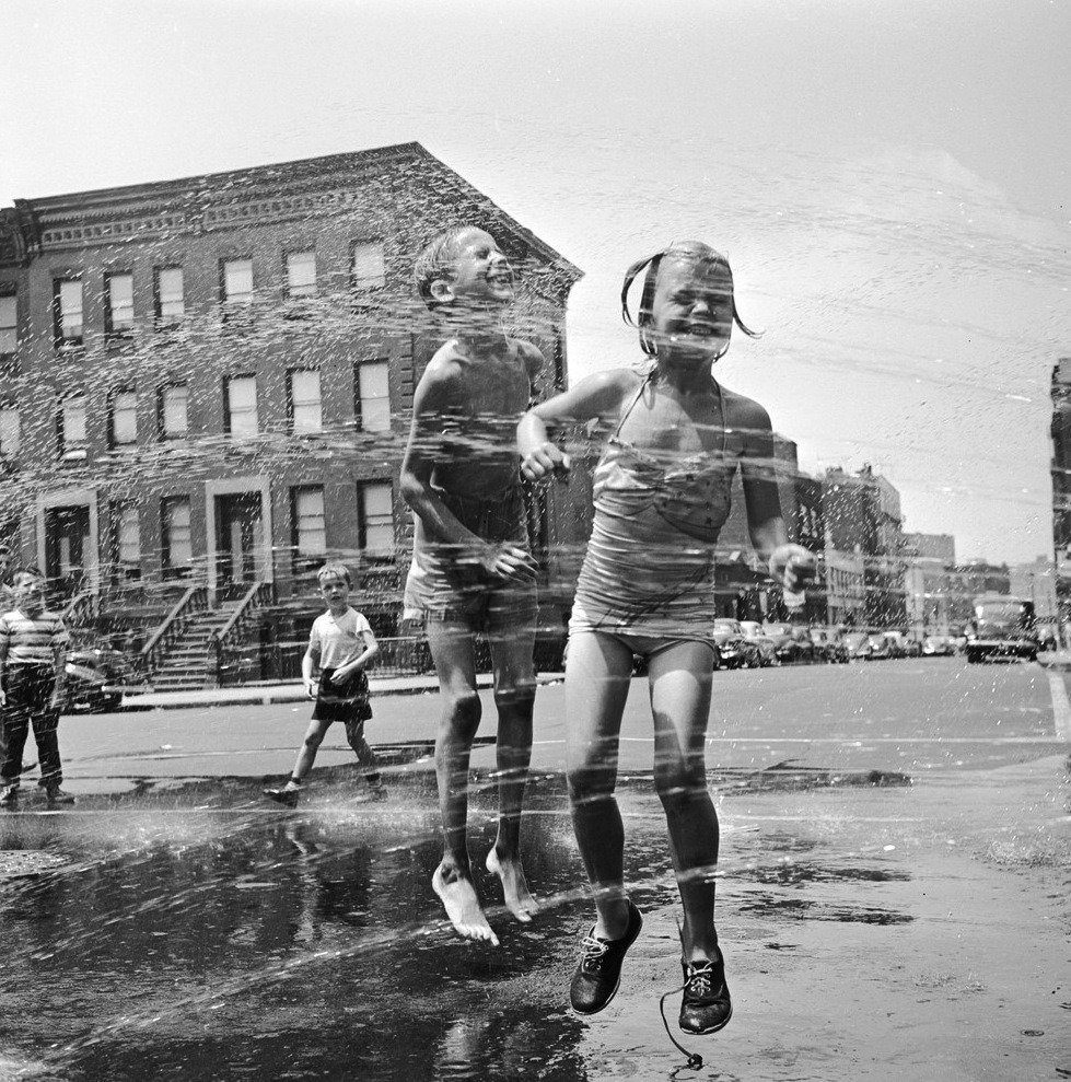 Two children jumping through a water hydrant’s shower on a New York street. They have come from a neighbouring co-educational playgroup organised by the city’s Police Department.
Orlando/Getty Images, 1950