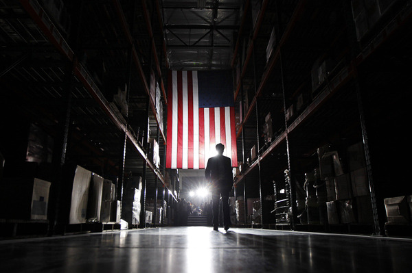 Mitt Romney exits the stage after a rally in Las Vegas (Photo by Gerald Herbert/AP)