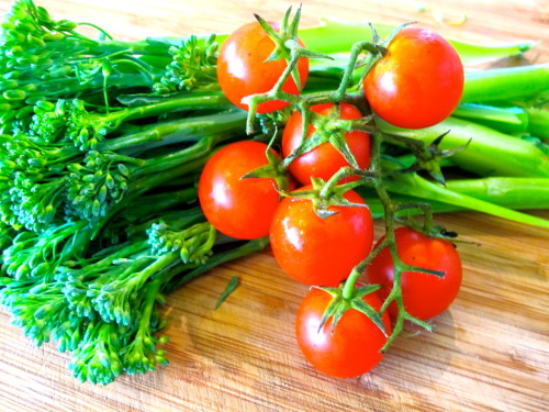 Fresh salmon, broccolini, and vine ripened tomatoes Intwined in zucchini noodles and accompanied wit