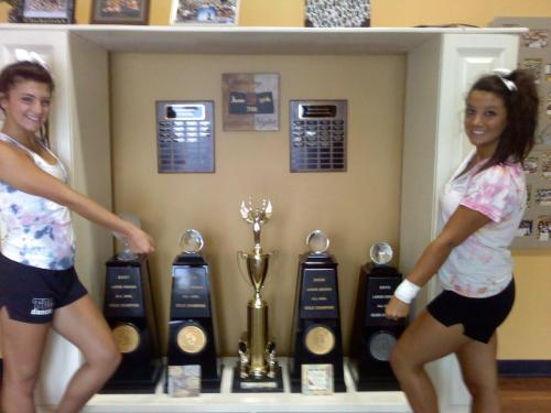 thecheersociety:  infront of the shooting stars worlds trophies in the stars gym - angelinascott