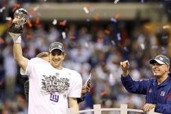 reuters:  New York Giants quarterback Eli Manning holds the Vince Lombardi trophy (L) as head coach Tom Coughlin looks on after the Giants defeated the New England Patriots in the NFL Super Bowl XLVI football game in Indianapolis, Indiana, February 5,