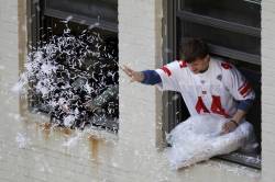 nationalpostsports:  A fan throws confetti during the New York Giants Super Bowl victory parade through the Canyon of Heroes. 