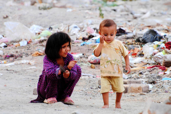 wounds-of-injustice:  Afghan children play near a refugee camp in Peshawar (Pakistan)