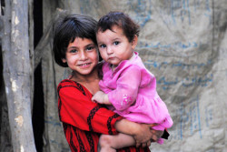 Wounds-Of-Injustice:  Afghan Children Play Near A Refugee Camp In Peshawar (Pakistan)