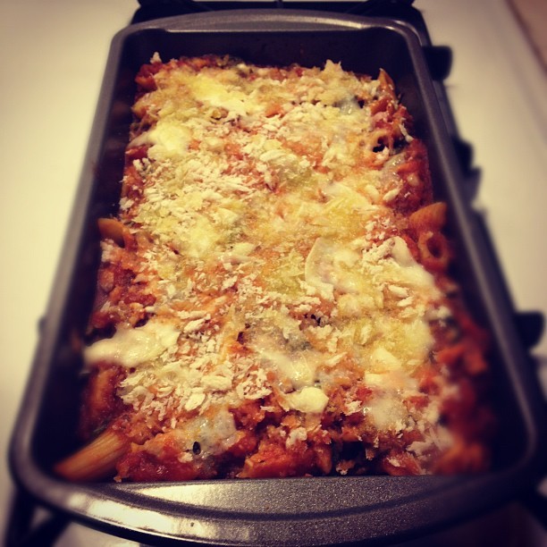 Baked penne with spinach, mushrooms, and pancetta. 