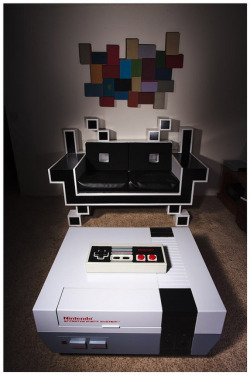 insanelygaming:  Video Game Furniture - by Matt Cyborgelt Note from Artist: Here is my most recent creations. Vintage book photo album wall art, Space Invader Couch, NES coffetable (Nintable), and my jumbo lap sized working wireless NES controller 