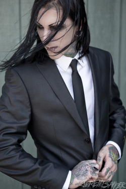 Suit. Long hair. Piercings. Tats. SOLD.