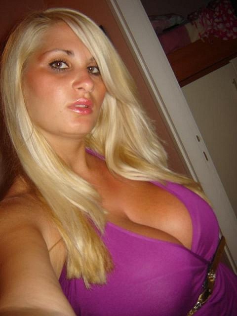 XXX Busty blonde in a purple dress photo