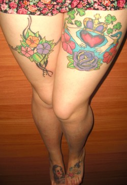 fuckyeahtattoos:  All of my tattoos hold meaning to me. My right thigh is my floral cross to represent my religion as a Roman Catholic. My left thigh is to show my Irish and Cuban ancestry with a claddagh ring and tropical flowers. My right foot is a