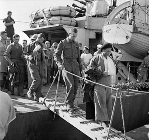 Wounded British troops disembarking at an Egyptian port after being evacuated from Crete, Greece, 31