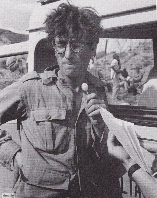 thegilly:John sucking a lollipop on the set of How I Won the War in Almeria, Spain, 1966. Photos by 