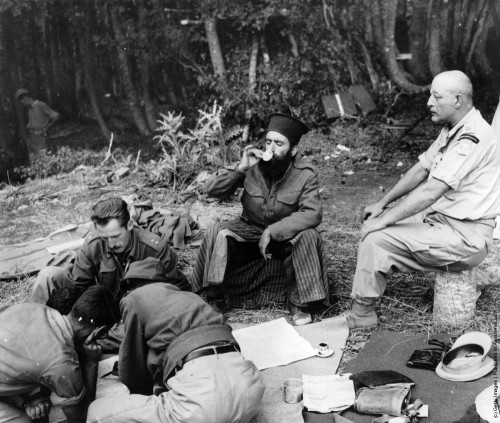 Officers plan the assault on Mount Kiapha at Mount Lyoku during the Greek Civil War, while a Greek O