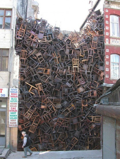 orabird:  Doris Salcedo (Colombia, 1958-) This piece was installed at the 2003 Istanbul Biennial using 1,550 wooden chairs. 