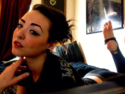 Girl with septum, nostril and plugs. http://piercingprincess.tumblr.com/