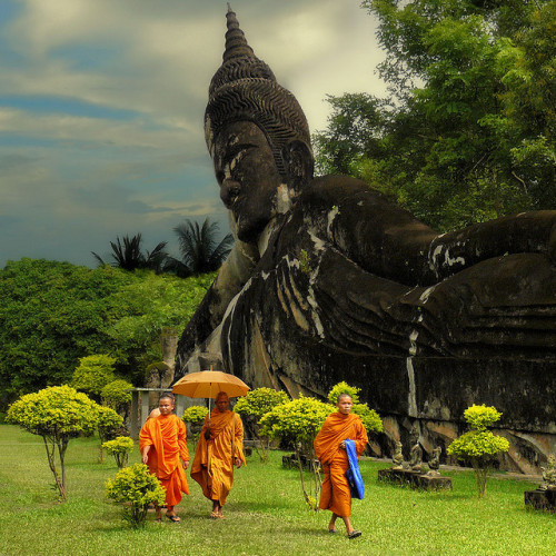 by B℮n on Flickr.Buddhist monks in Xieng Khuan park located 25 km southeast from Vientiane, Laos.