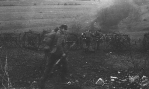 ironeurope:Haumont Woods, Verdun, February 21, 1916. In the background is a flamethrower squad of th