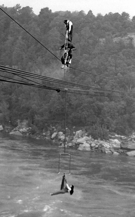 firsttimeuser:Henri Rechatin walking a tight rope on the wires of the Spanish Aero Car Niagara Falls