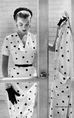 theniftyfifties:  Model wearing a spotted dress for Harper’s Bazaar, January 1957.  Photo by John Engstead. 
