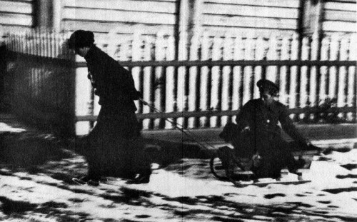 zolotoivek:Aleksei being pulled on a sled by one of his sisters, Tobolsk, 1917-18.