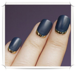 modcloth:  A gold and navy manicure via This