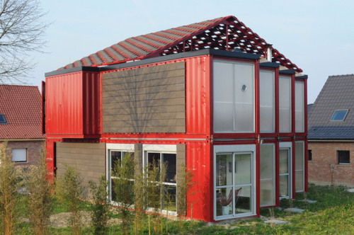 Eight used shipping containers were repurposed in the building of this residence, designed by Patrick Partouche, in Lille, France.
The 2,100+-square-foot building features large windows and a gabled roof structure, which I suppose serves as a cooling...