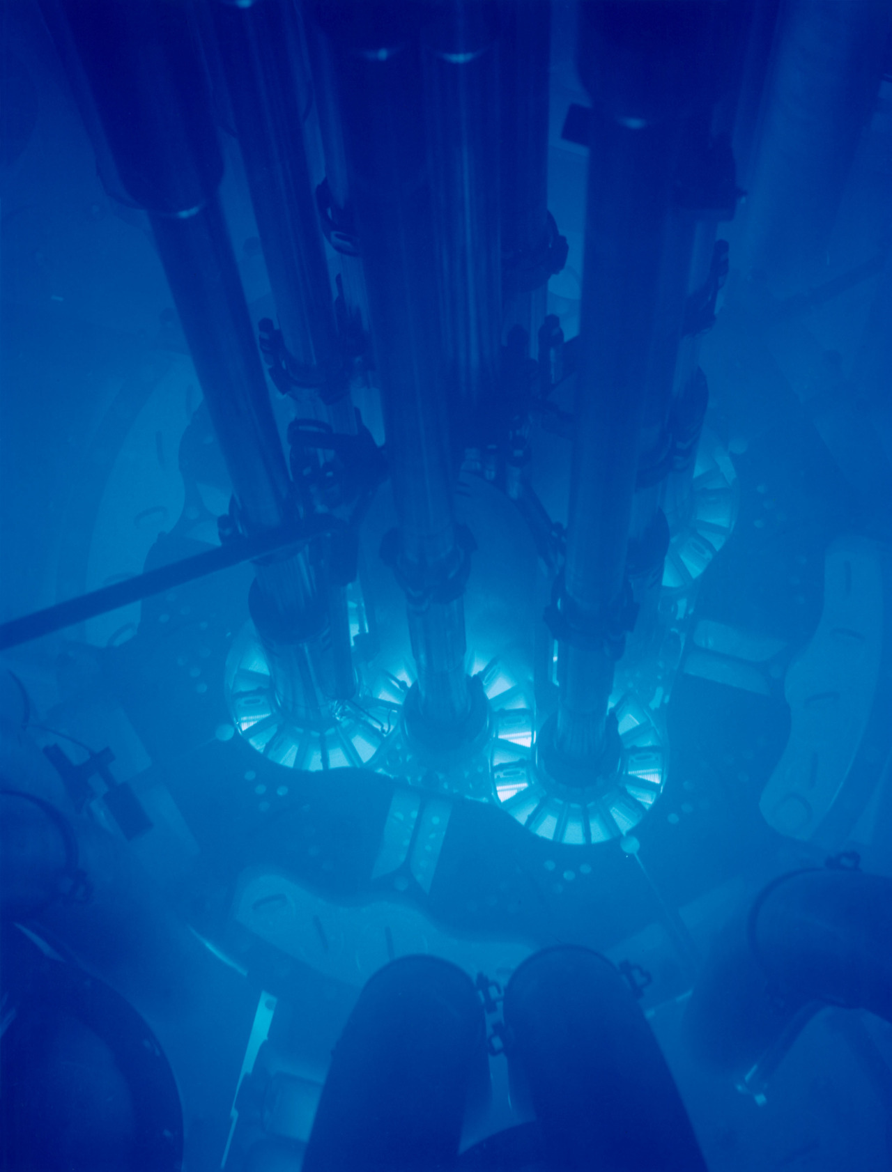 Idaho National Laboratory’s Advanced Test Reactor (ATR) powered up. The fuel plates can be seen glowing bright blue due to Cherenkov radiation. The core is submerged in water for cooling.