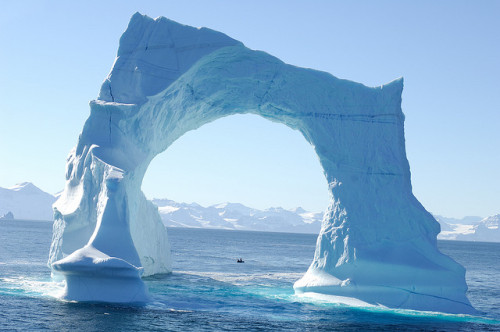 by francois Dequidt on Flickr. Floating arch iceberg in the waters of Greenland.