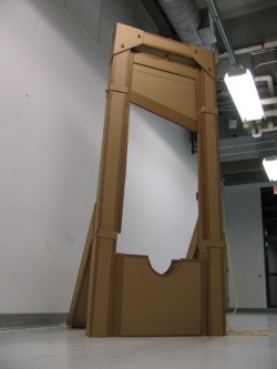 greytaliesin:  I built this my freshman year of art school; our assignment was to replicate a device out of cardboard that was at least 5 feet in height or breadth and had a working mechanism of some kind using only cardboard, shipping tape, hot glue,