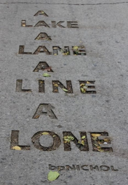 bpNichol Lane, Toronto, Canada. The eight-line poem is located in the Annex behind Coach House Books