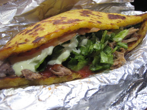 Patacon Pisao, the famous Venezuelan food truck from Washington Heights, now has a storefront in Elmhurst. The cachapas sandwich above uses sweet corn cakes instead of bread. It’s stuffed with lettuce, tomatoes, ketchup, pernil (roast pork), queso...